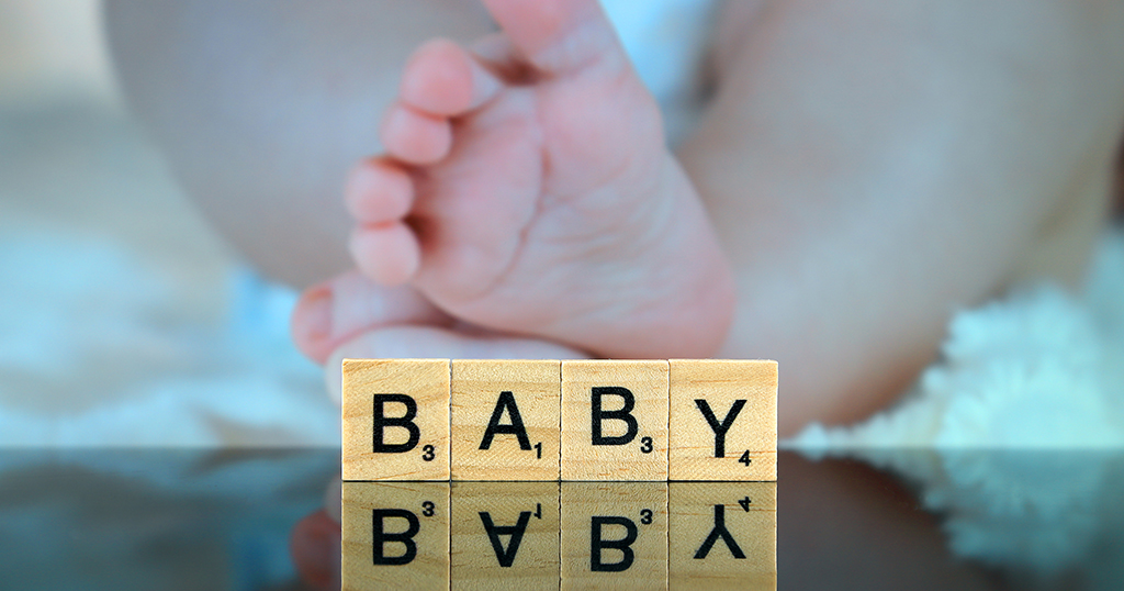 Baby spelled out in Scrabble letters
