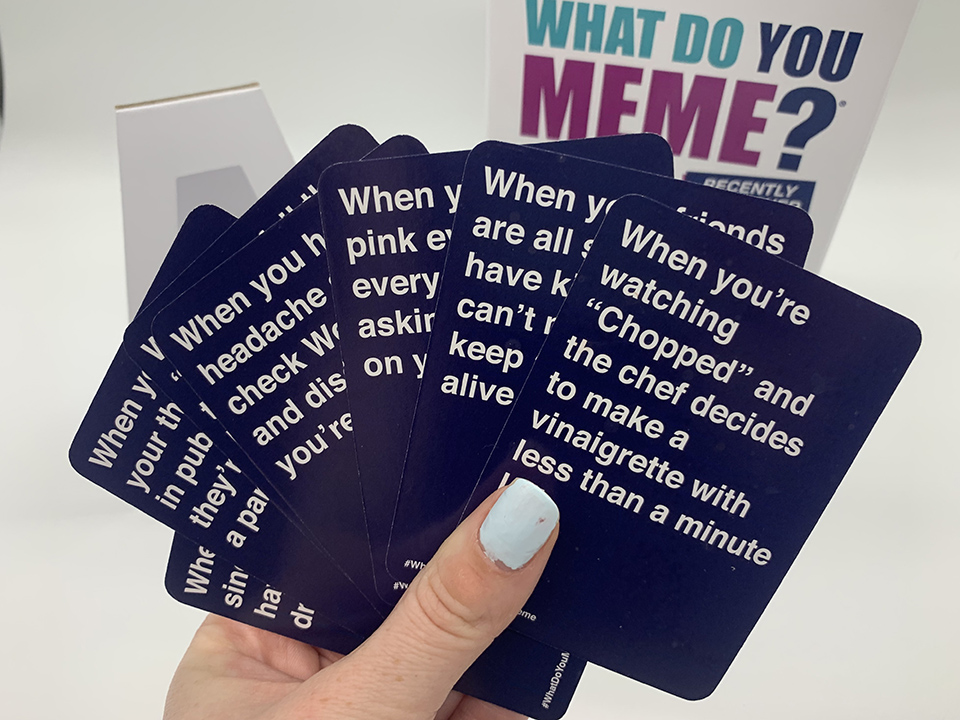 A deck of caption cards in what do you meme 
