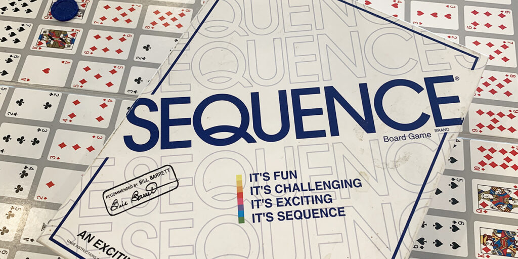 sequence the board game with board in background