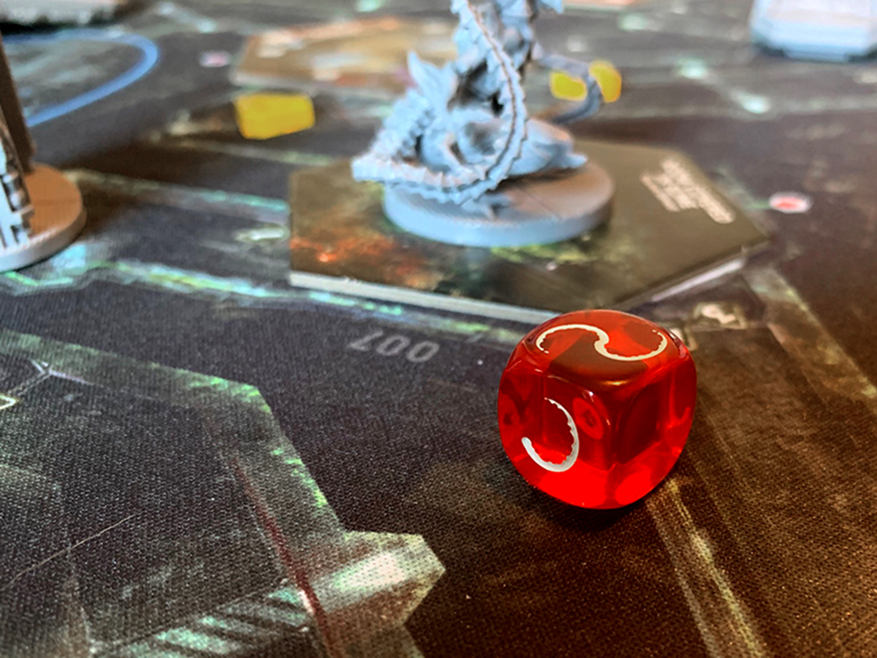 intruder red dice with symbols in the board game nemesis 